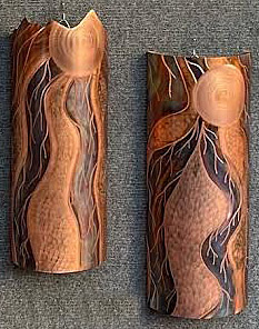 two flame painted sconces